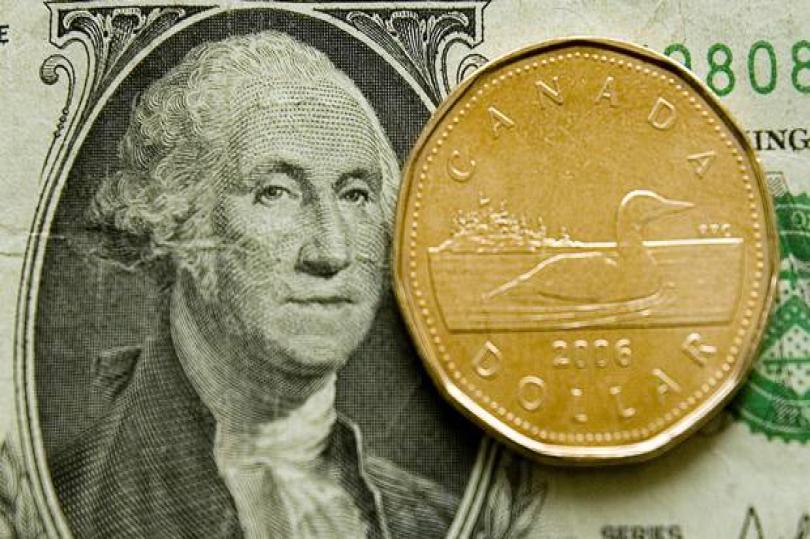 الدولار كندي يُقلص خسائره